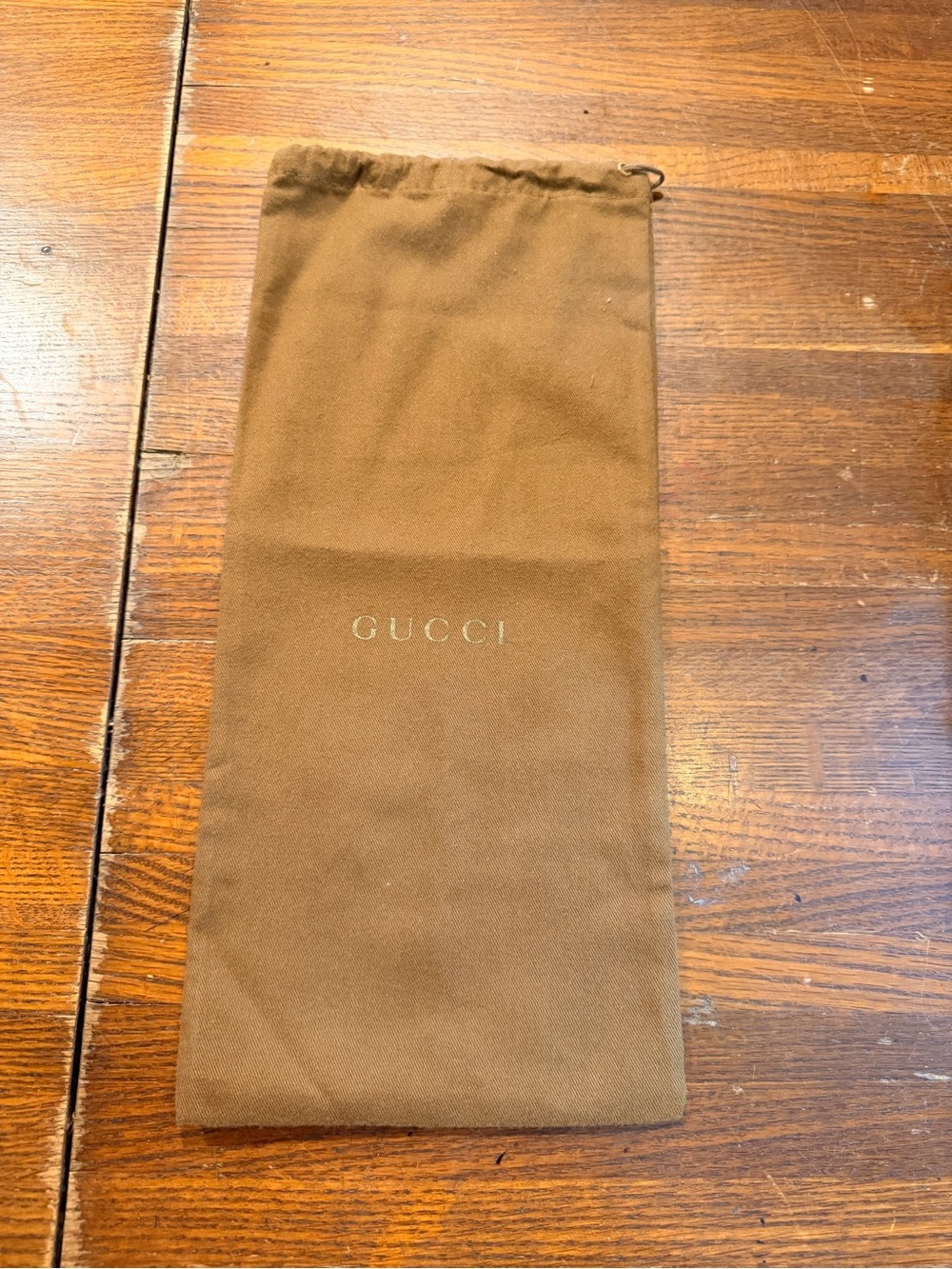 Brown flannel Gucci drawstring dust bag